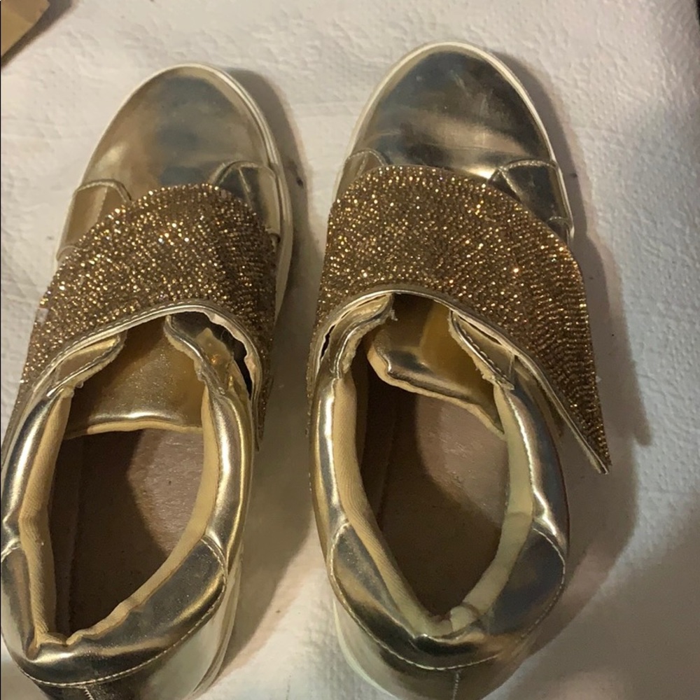 Gold tennis shoes